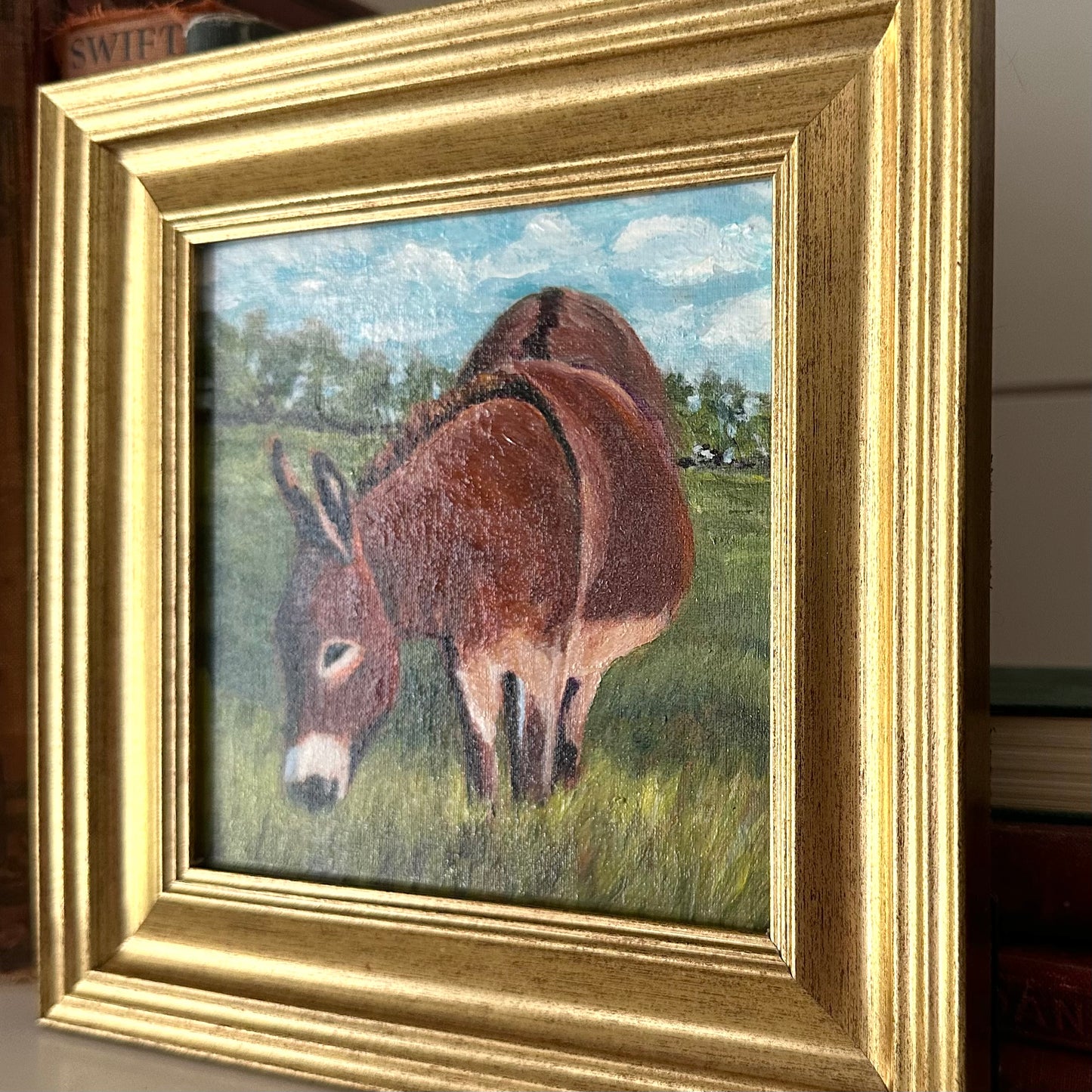 Grazing Donkey in a Field of Green